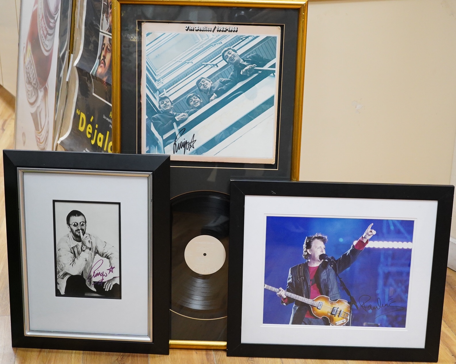 Three framed Beatles autographs; a framed signed album (missing Lennon), 84 x 44cm overall a photograph of Paul McCartney and a photograph of Ringo Starr, both signed across the image